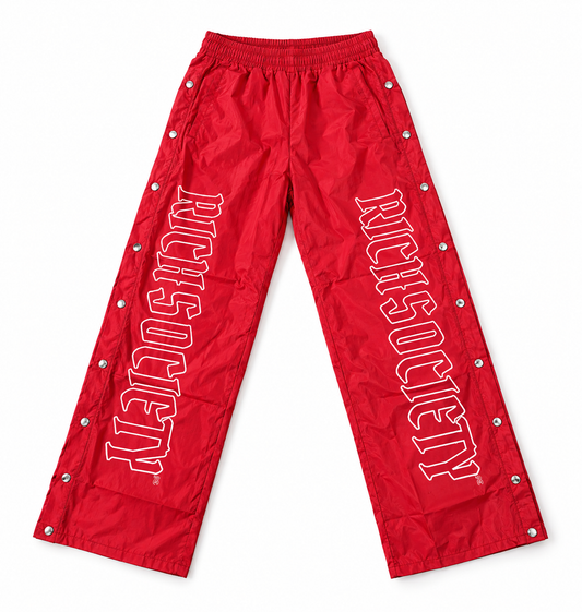 Red RichSociety snap pants — full-pair mockup